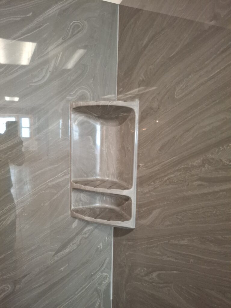 Compare marble vs acrylic shower systems, including durability, maintenance, style, and value to find the best fit for your bathroom remodel.