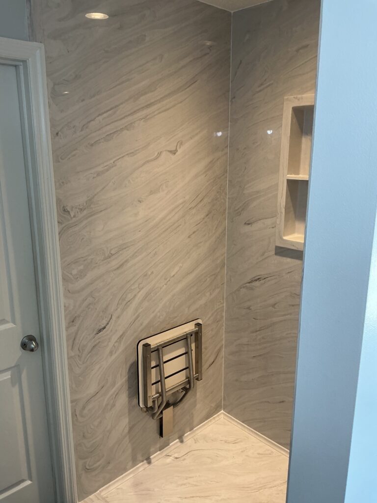 Compare marble vs acrylic shower systems, including durability, maintenance, style, and value to find the best fit for your bathroom remodel.